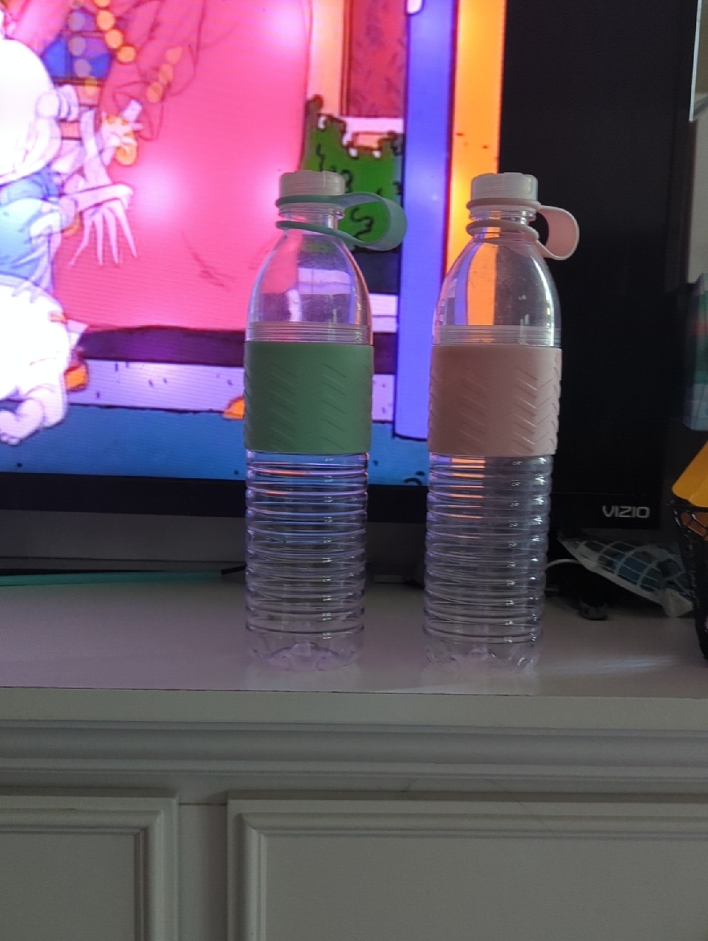 Clear Reusable Water Bottle Pair with Green and Blush Silicone Grips